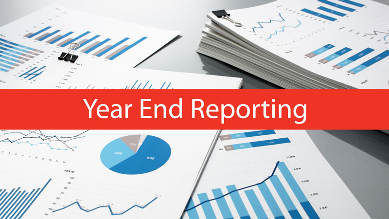 Image of documents showing charts and the words: Year-End Reporting